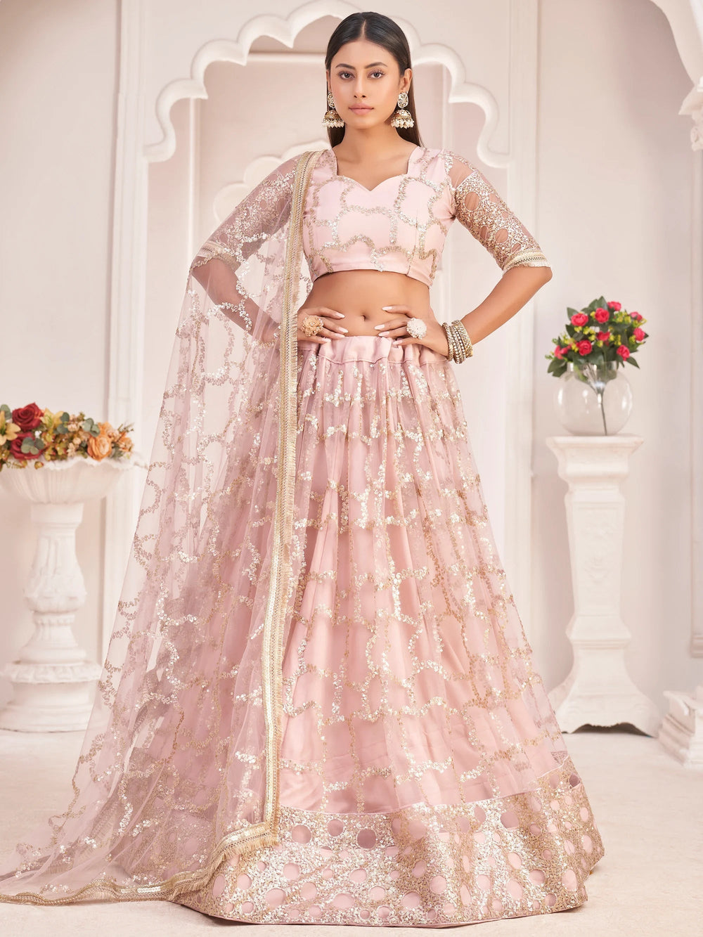 Prominent Pastel Pink Sequins Embroidery Net Lehenga Choli for Women