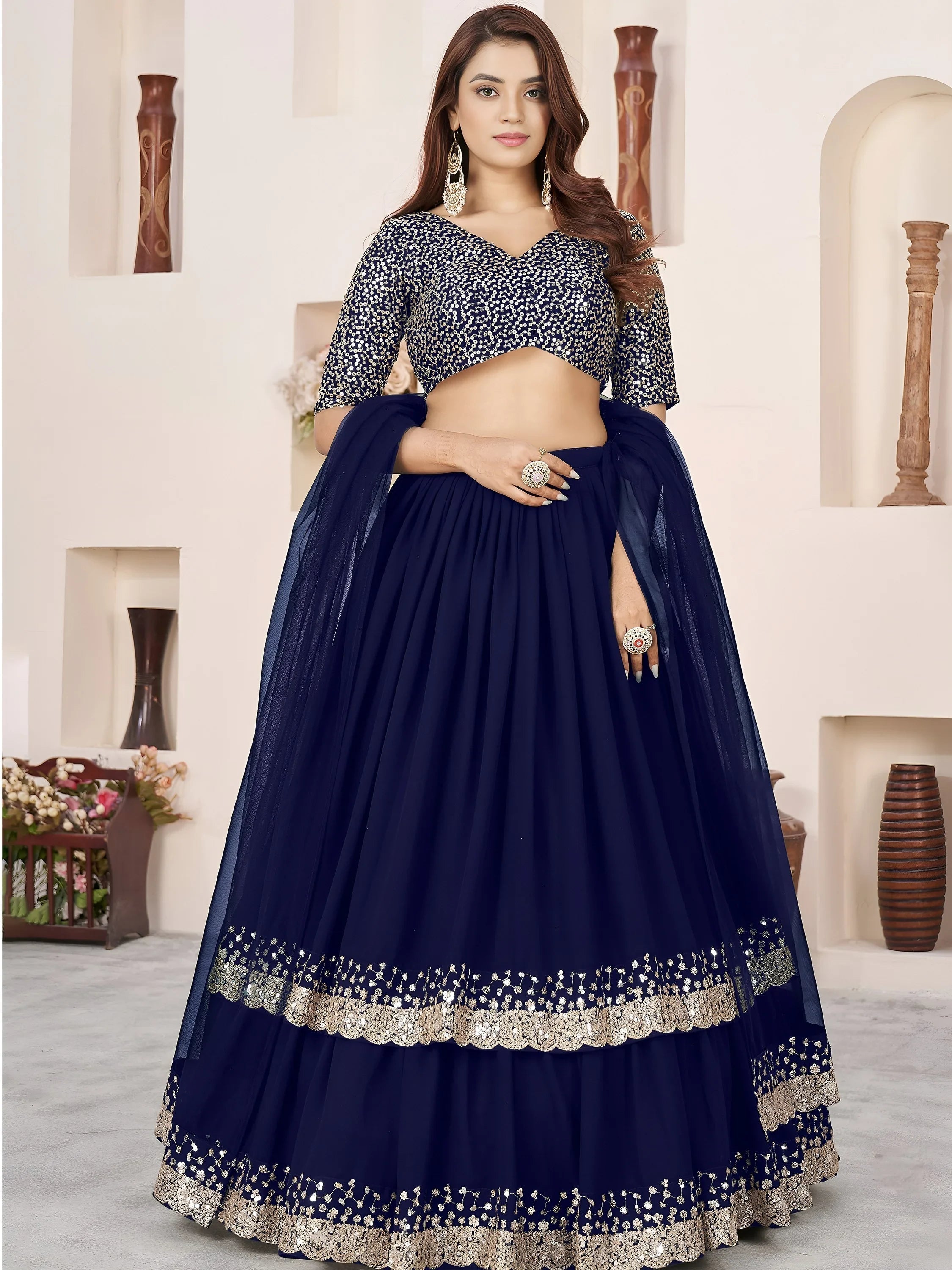 Sequins embroidered georgette lehenga choli for wedding reception and party wear