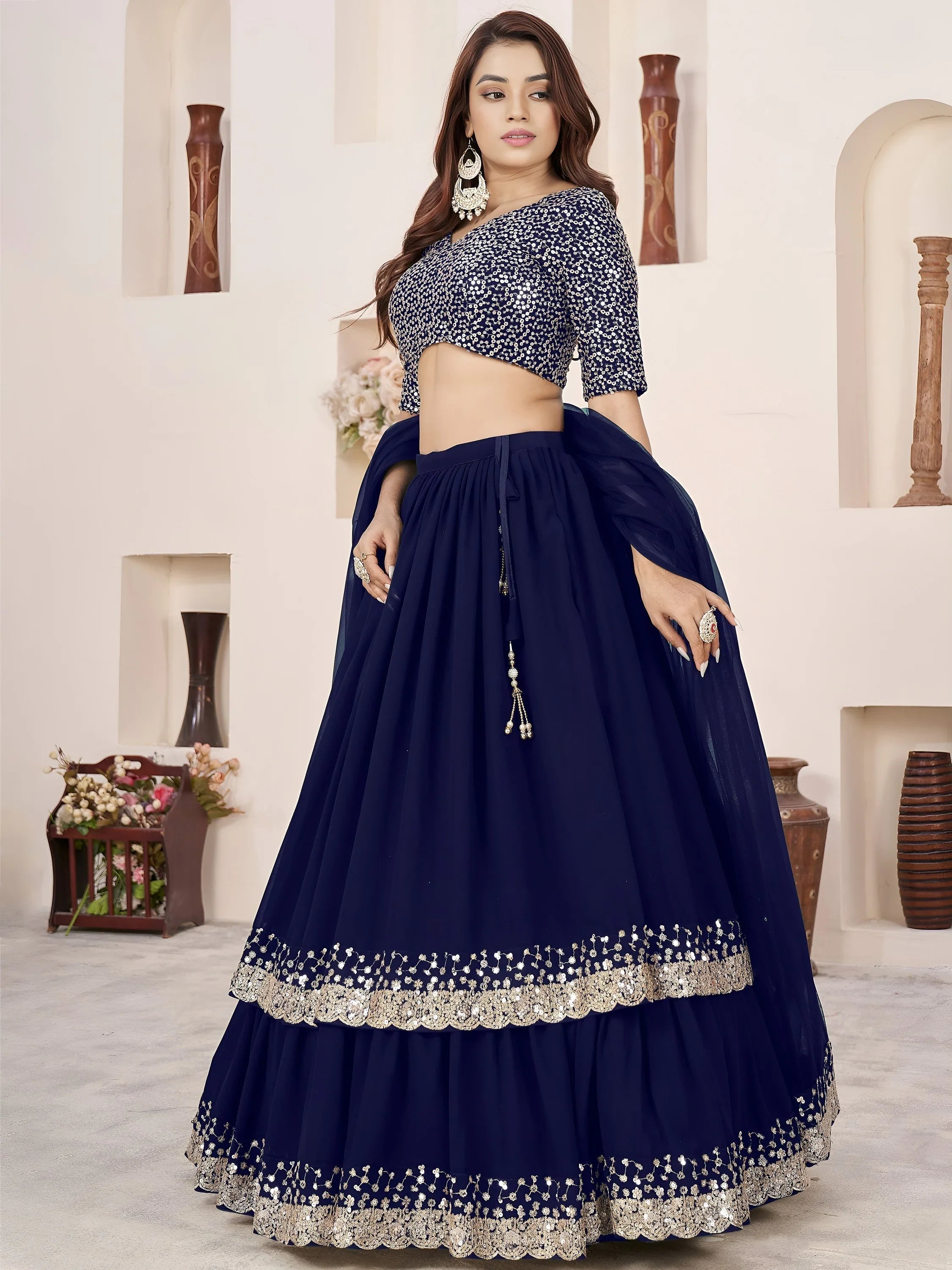 Sequins embroidered georgette lehenga choli for wedding reception and party wear