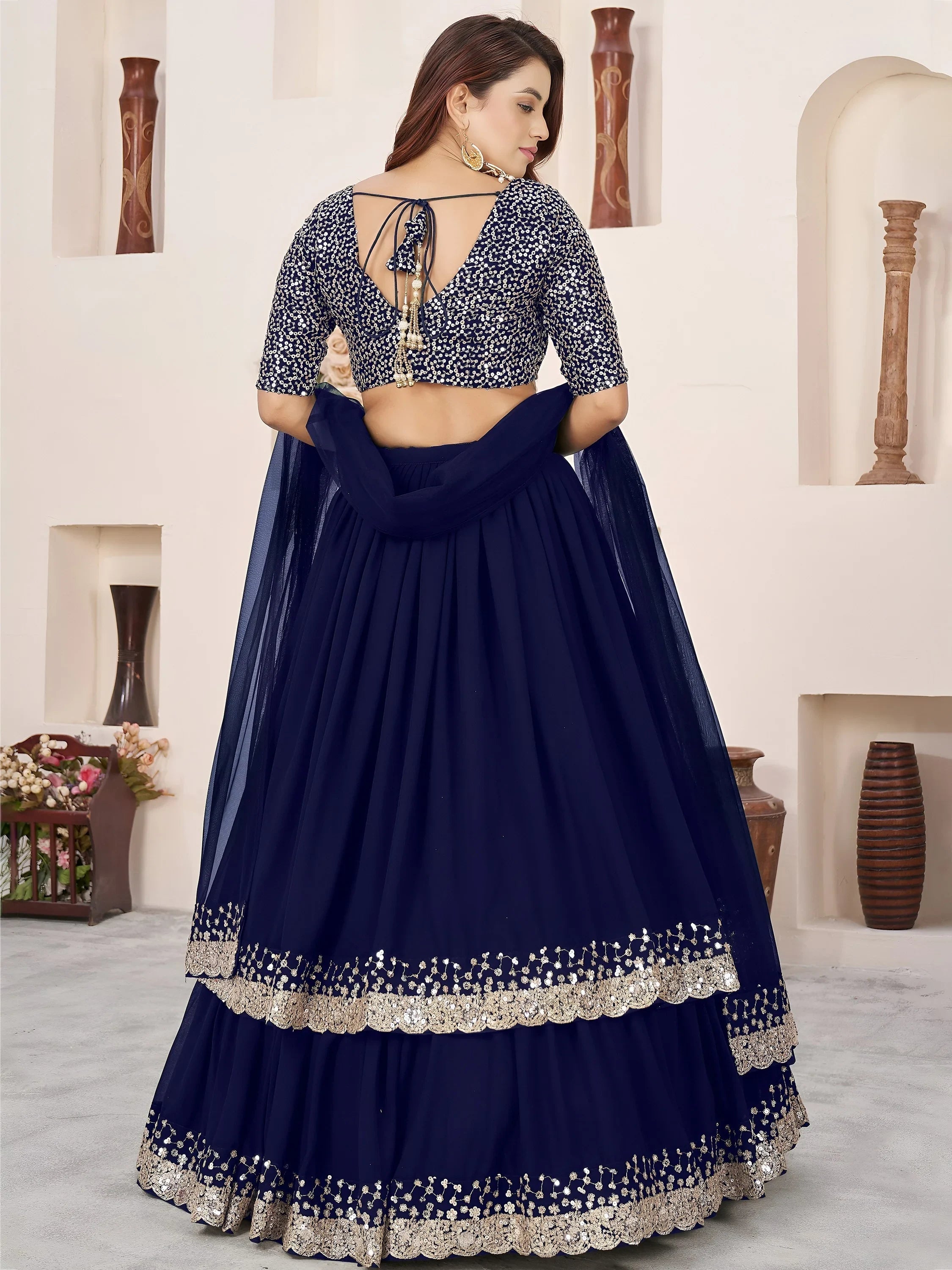 Sequins embroidered georgette lehenga choli for wedding reception and party wear