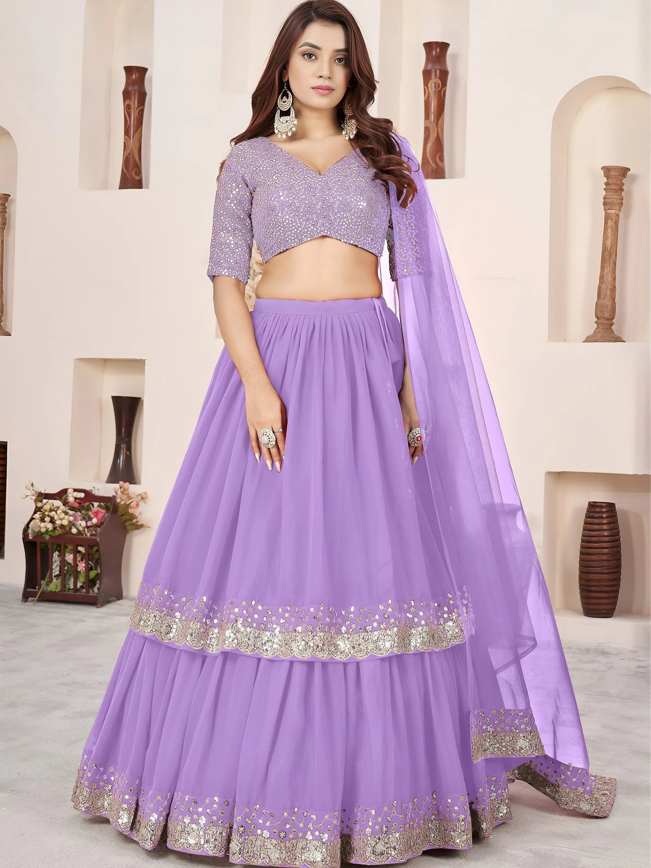 Sequins embroidered georgette lehenga choli for wedding reception and party wear