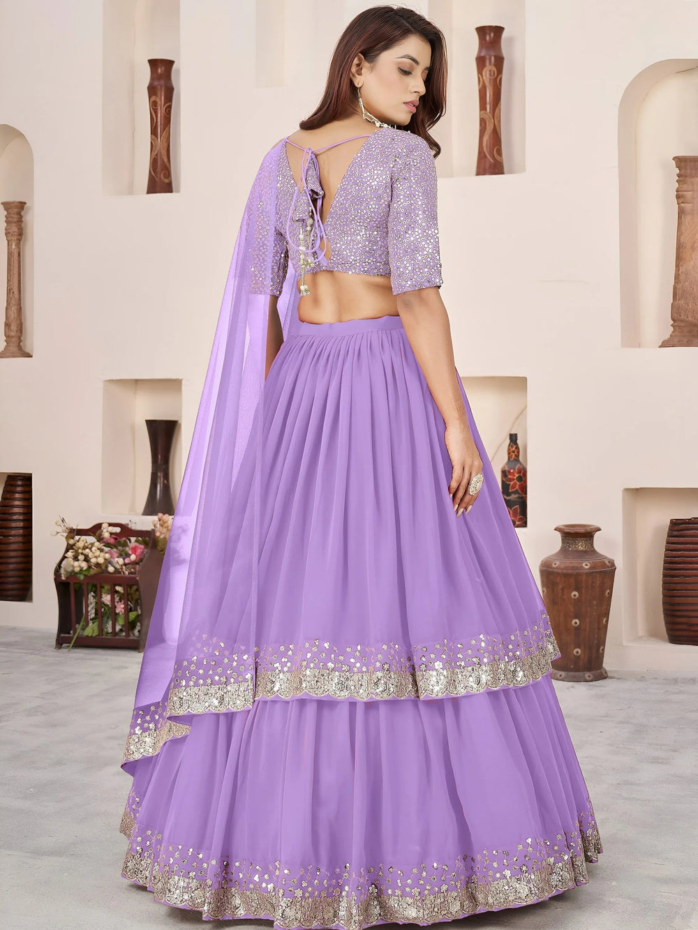 Sequins embroidered georgette lehenga choli for wedding reception and party wear