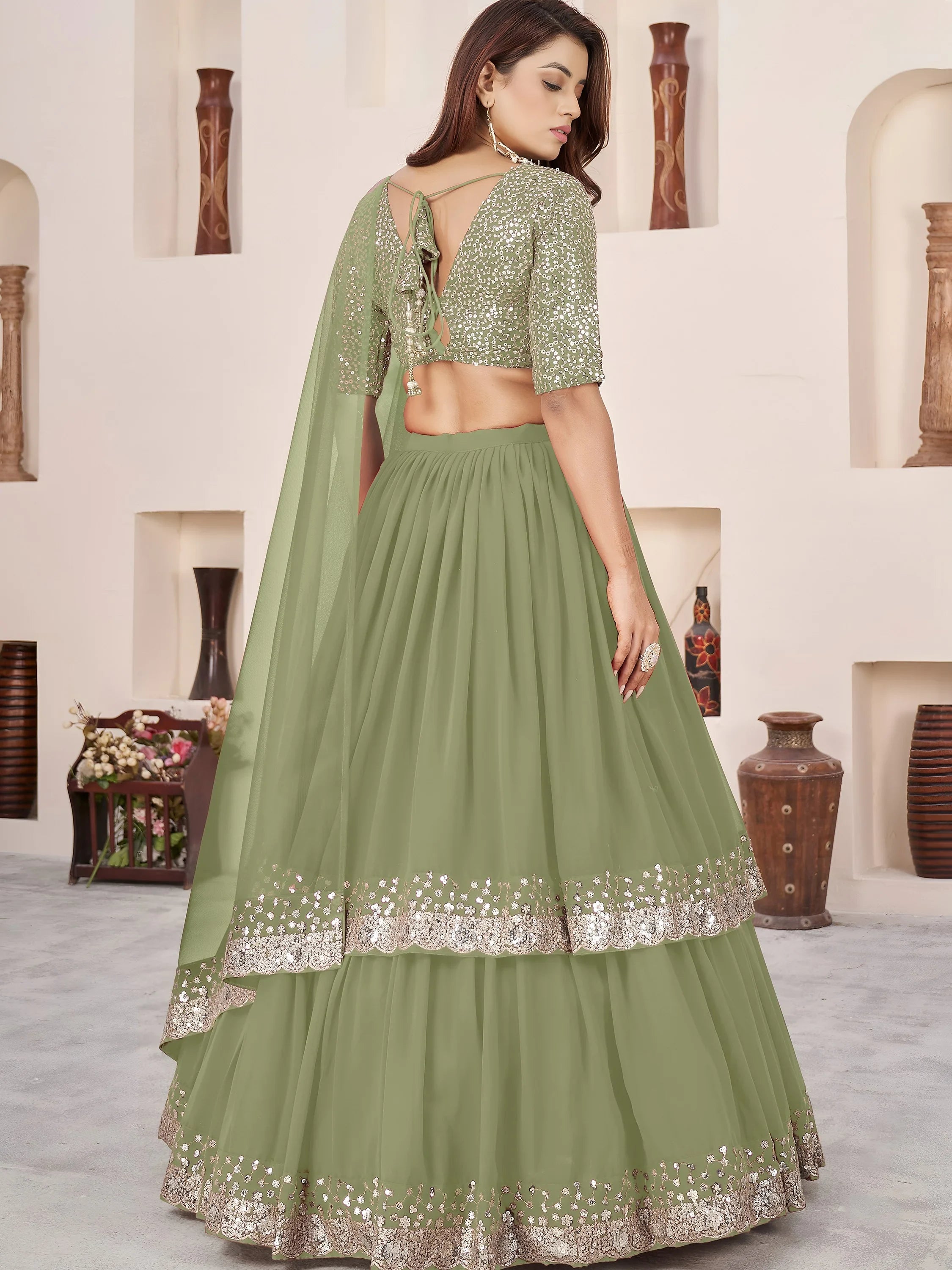 Sequins embroidered georgette lehenga choli for wedding reception and party wear