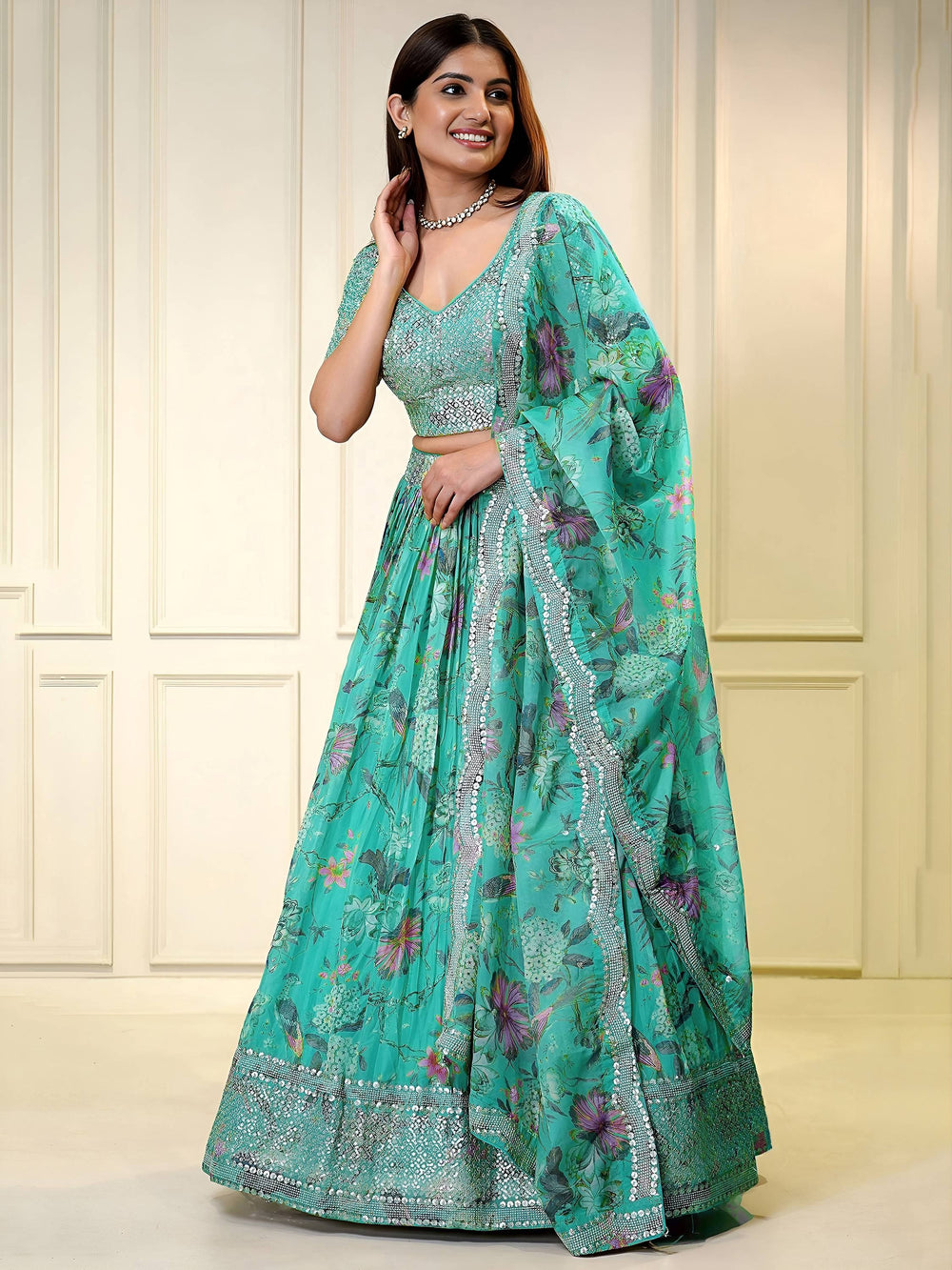 Sequins embellished organza lehenga choli for wedding and party occasions