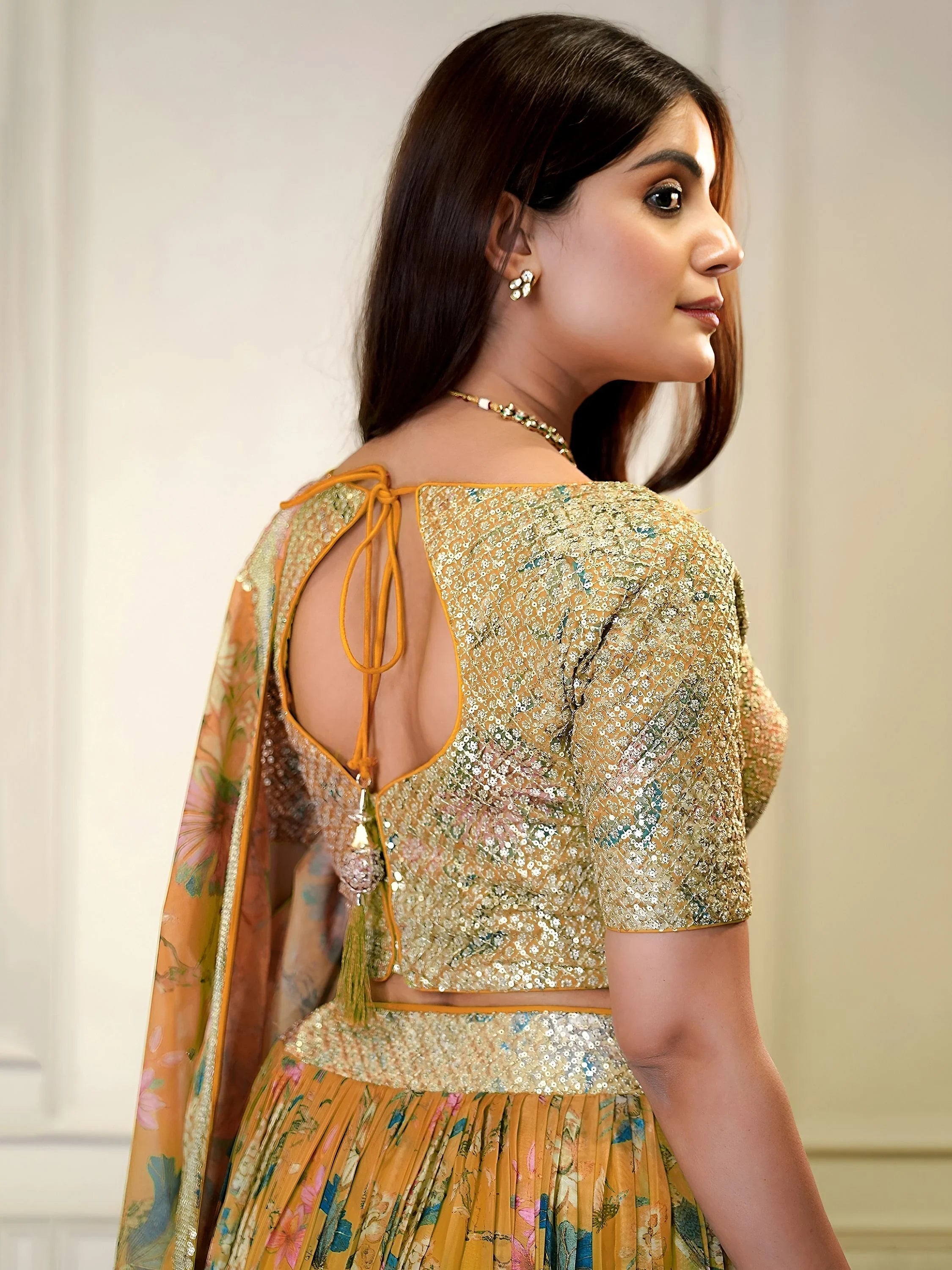 Sequins embellished organza lehenga choli for wedding and party occasions