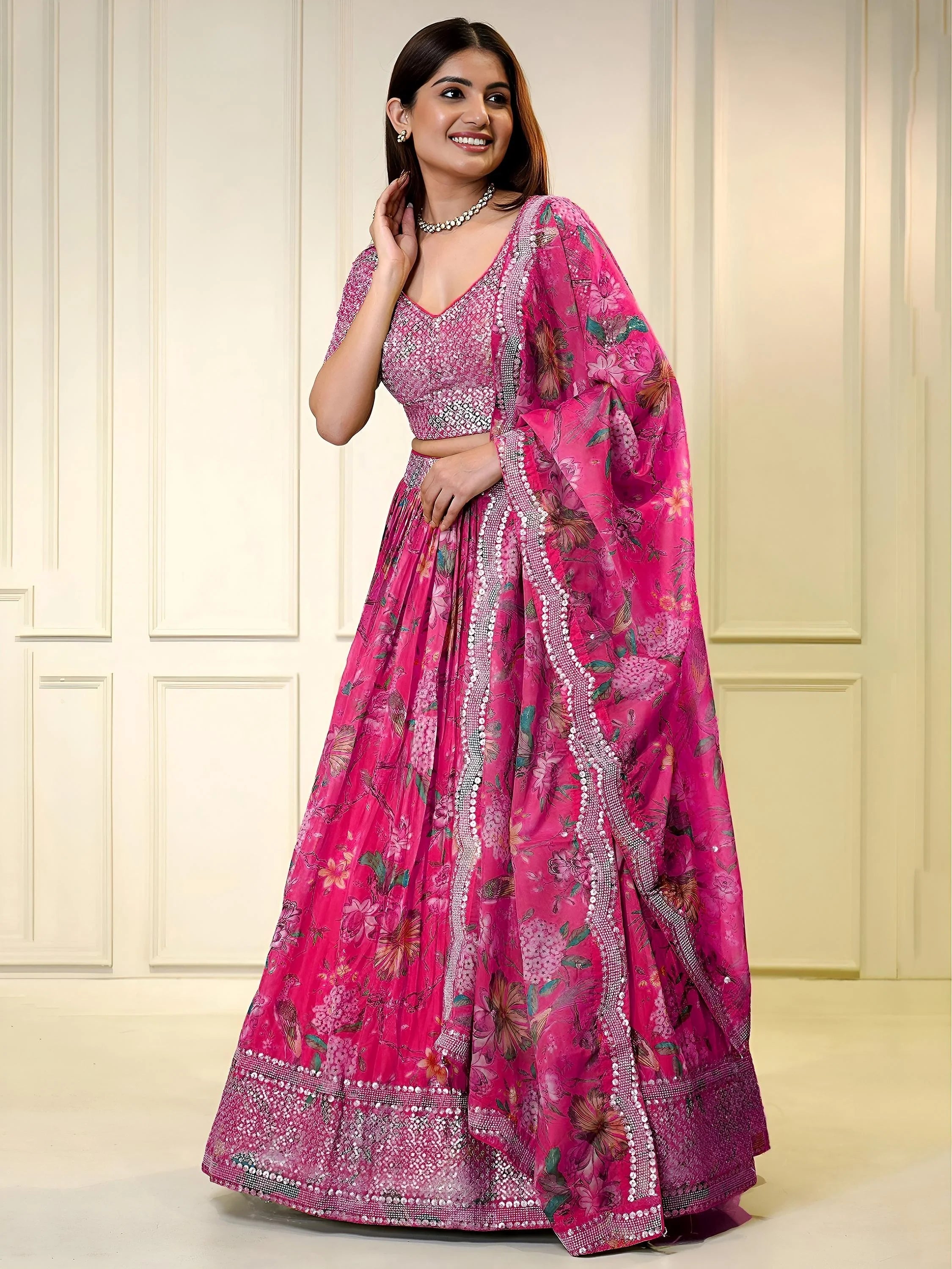 Sequins embellished organza lehenga choli for wedding and party occasions