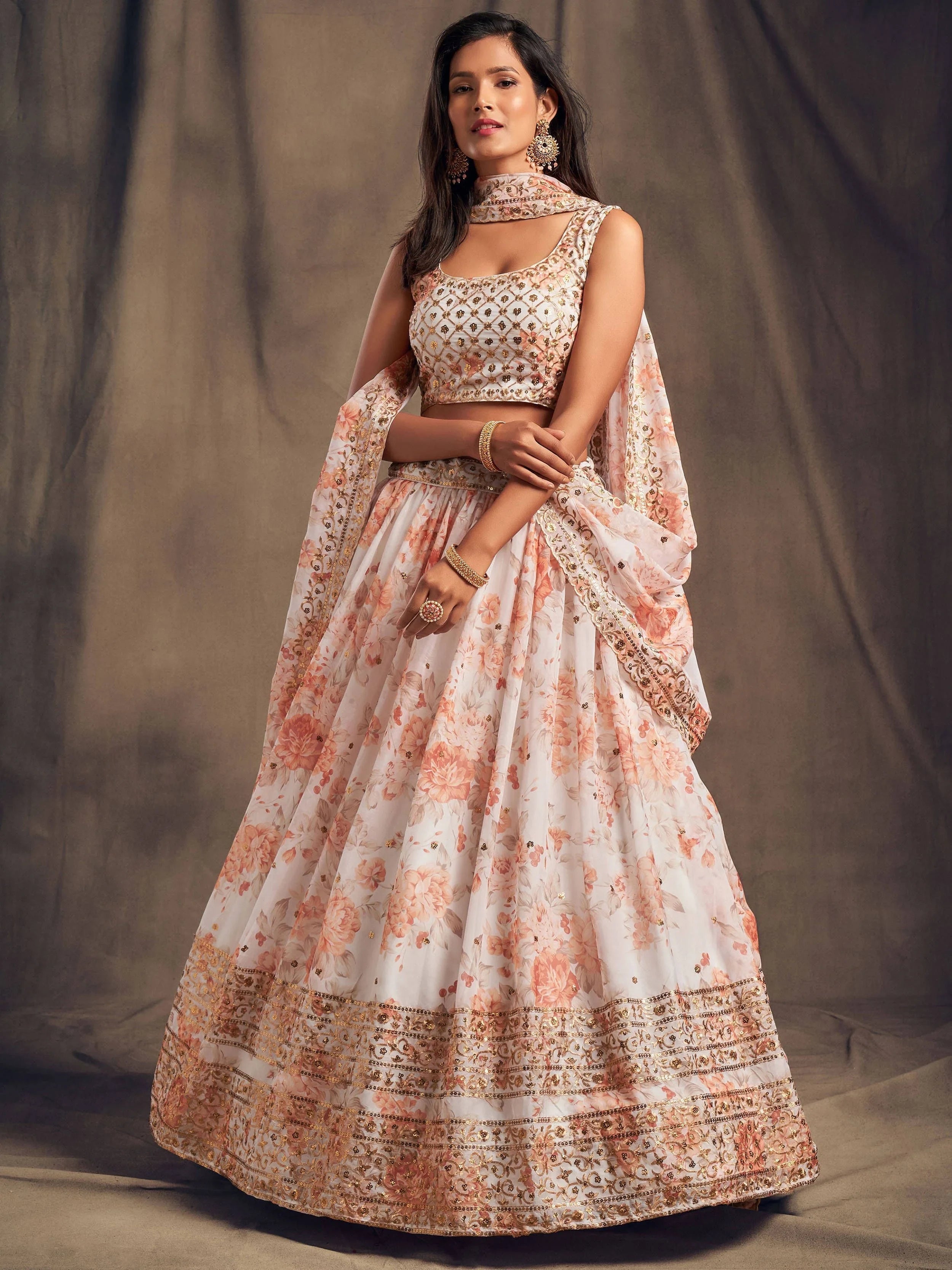 Organza lehenga choli with sequin embellishment and floral embroidery for wedding and festive wear