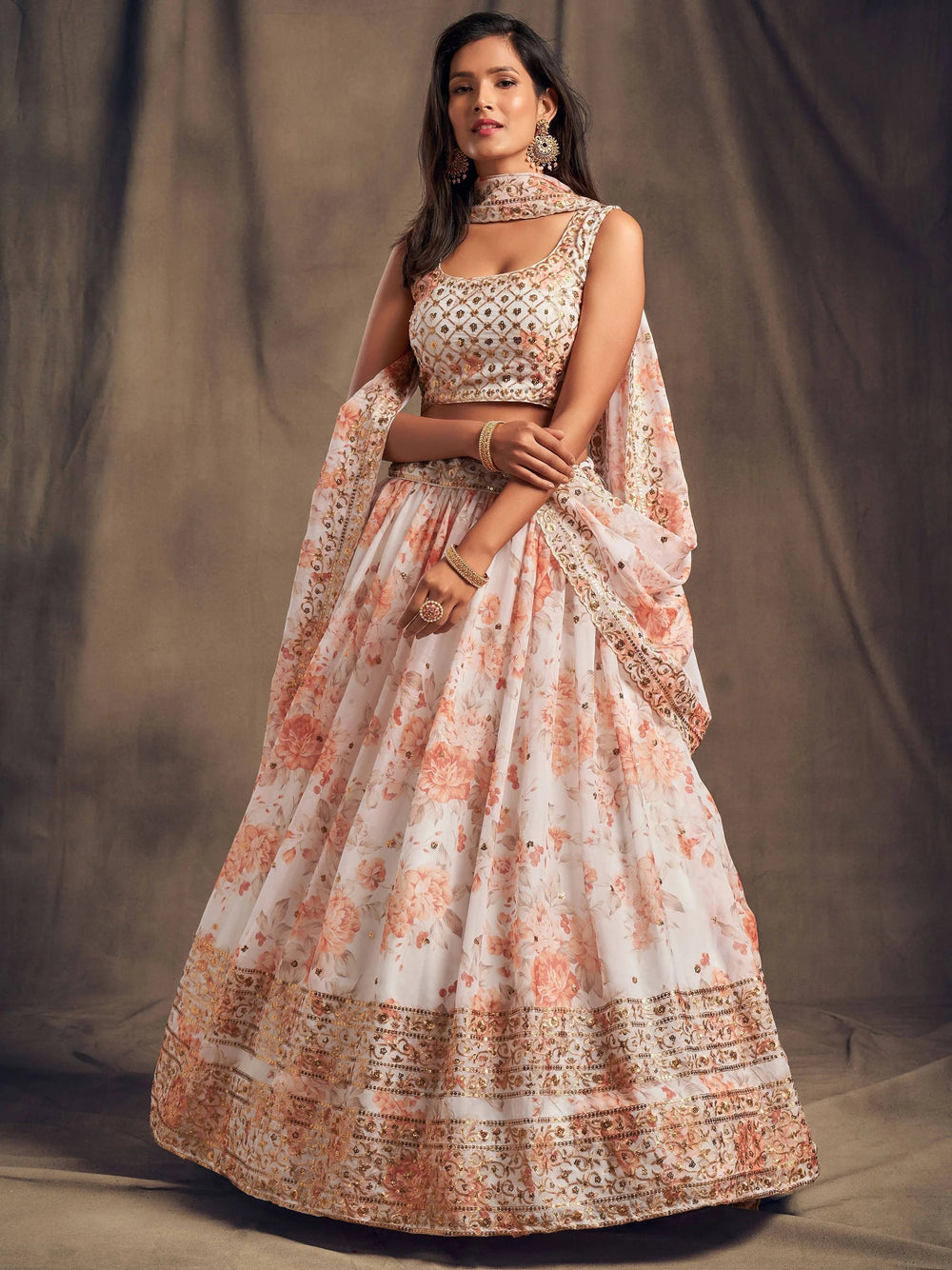 Organza lehenga choli with sequin embellishment and floral embroidery for wedding and festive wear
