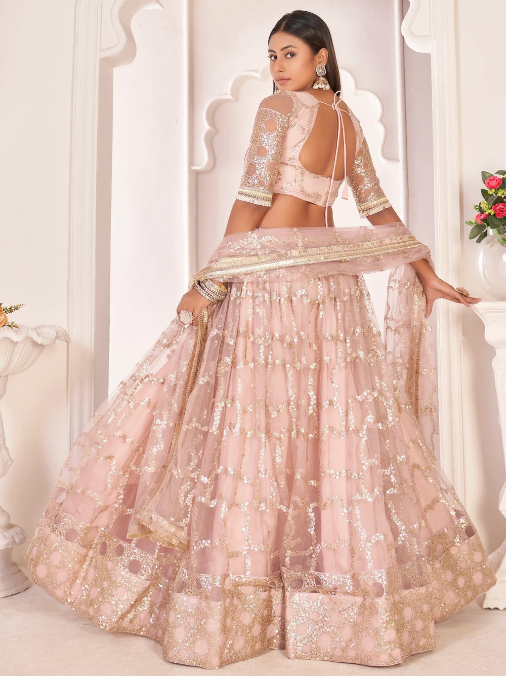 Prominent Pastel Pink Sequins Embroidery Net Lehenga Choli for Women