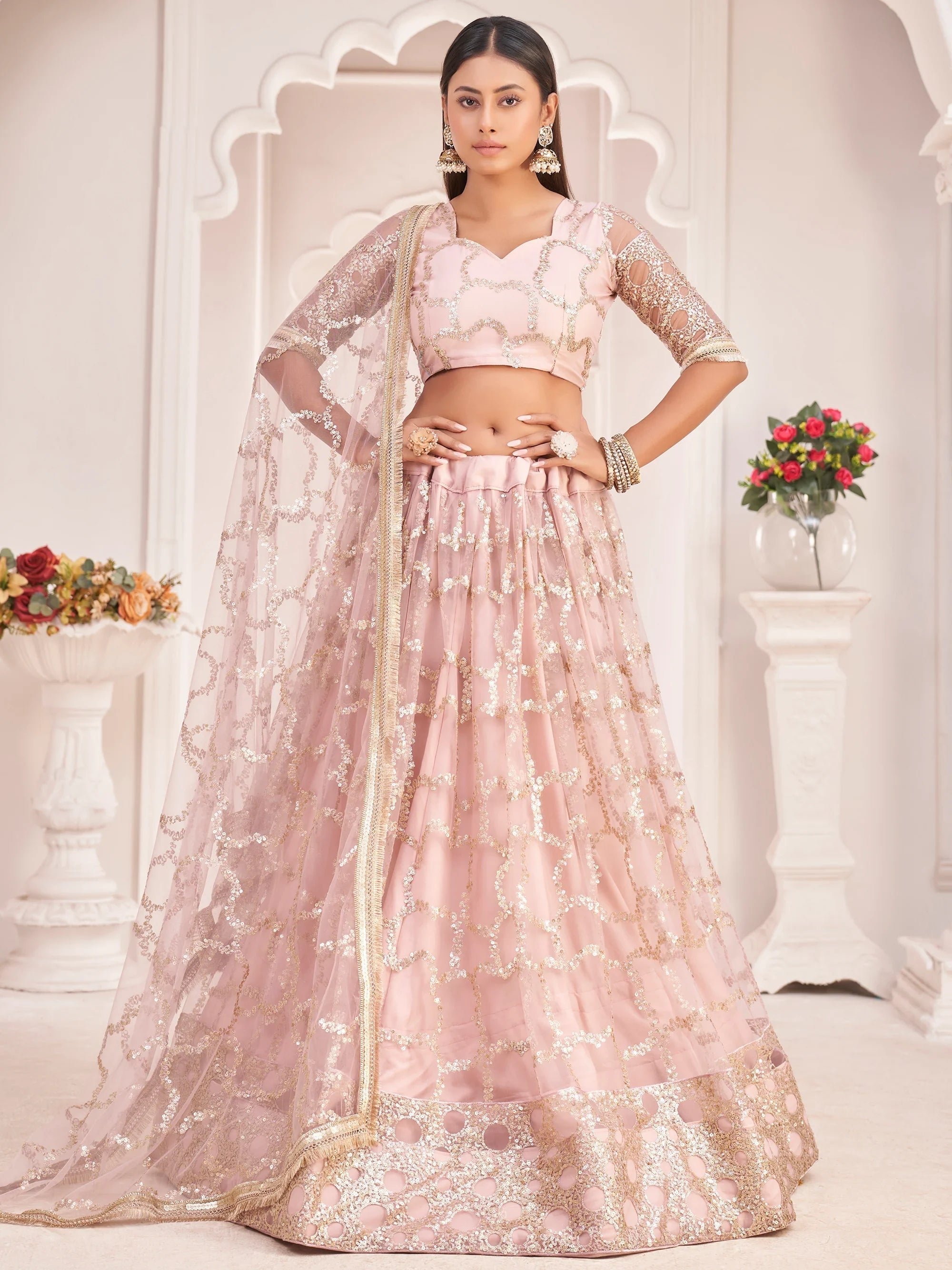 Prominent Pastel Pink Sequins Embroidery Net Lehenga Choli for Women