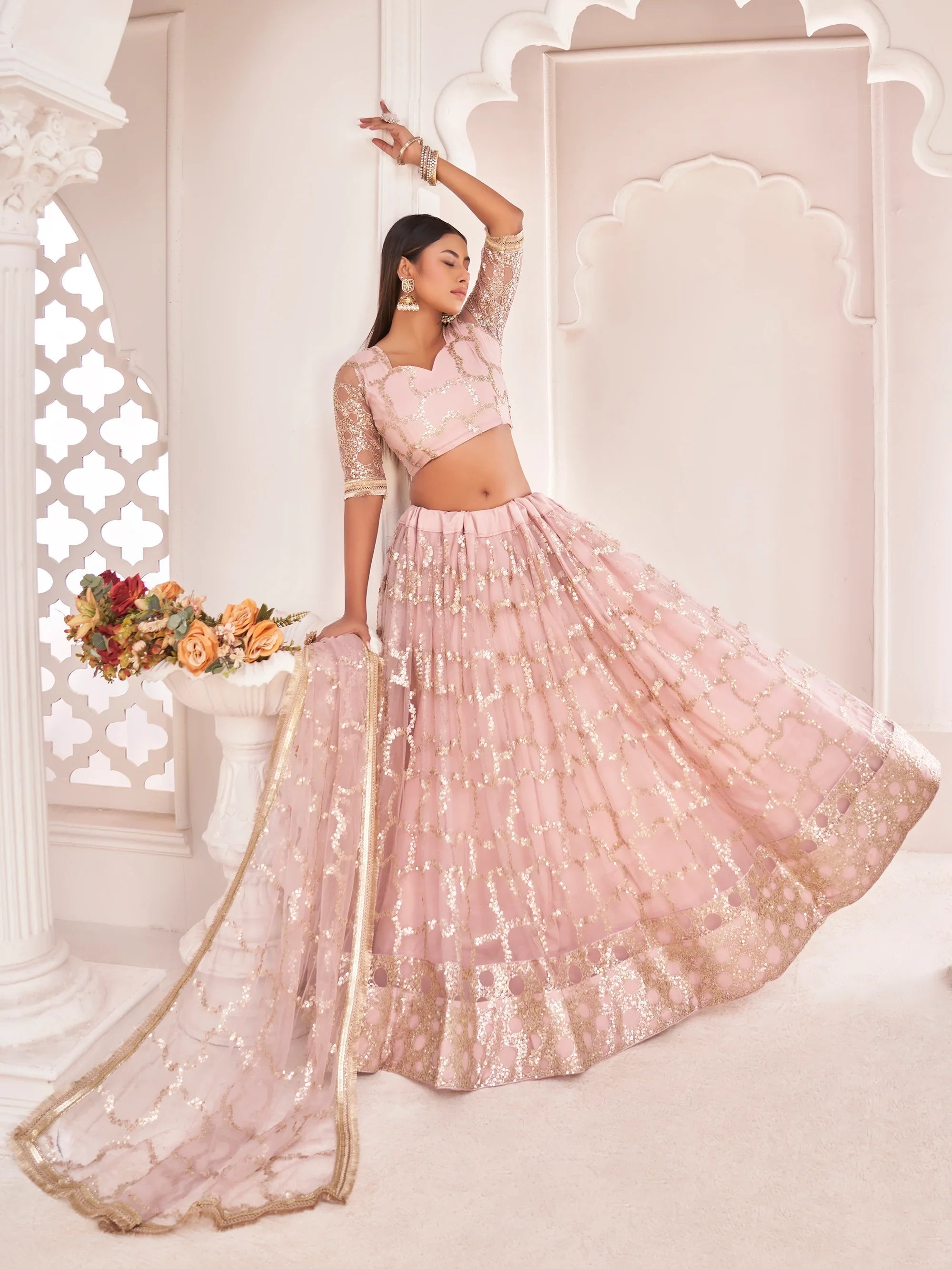 Prominent Pastel Pink Sequins Embroidery Net Lehenga Choli for Women
