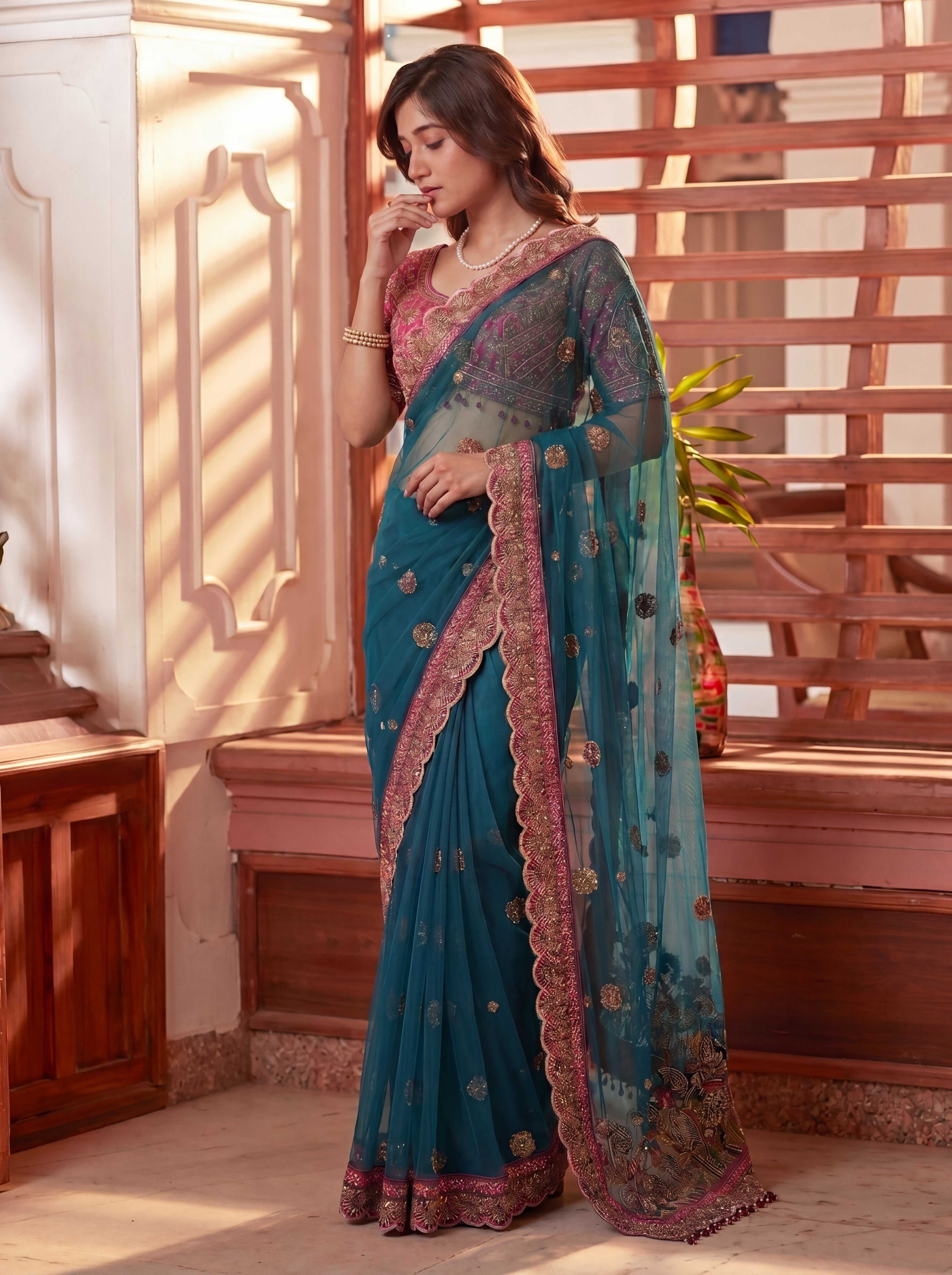 Royal Firozi Net Saree with Intricate Sequins, Mirror Work, Embroidery, Cording & Handcrafted Border Detailing