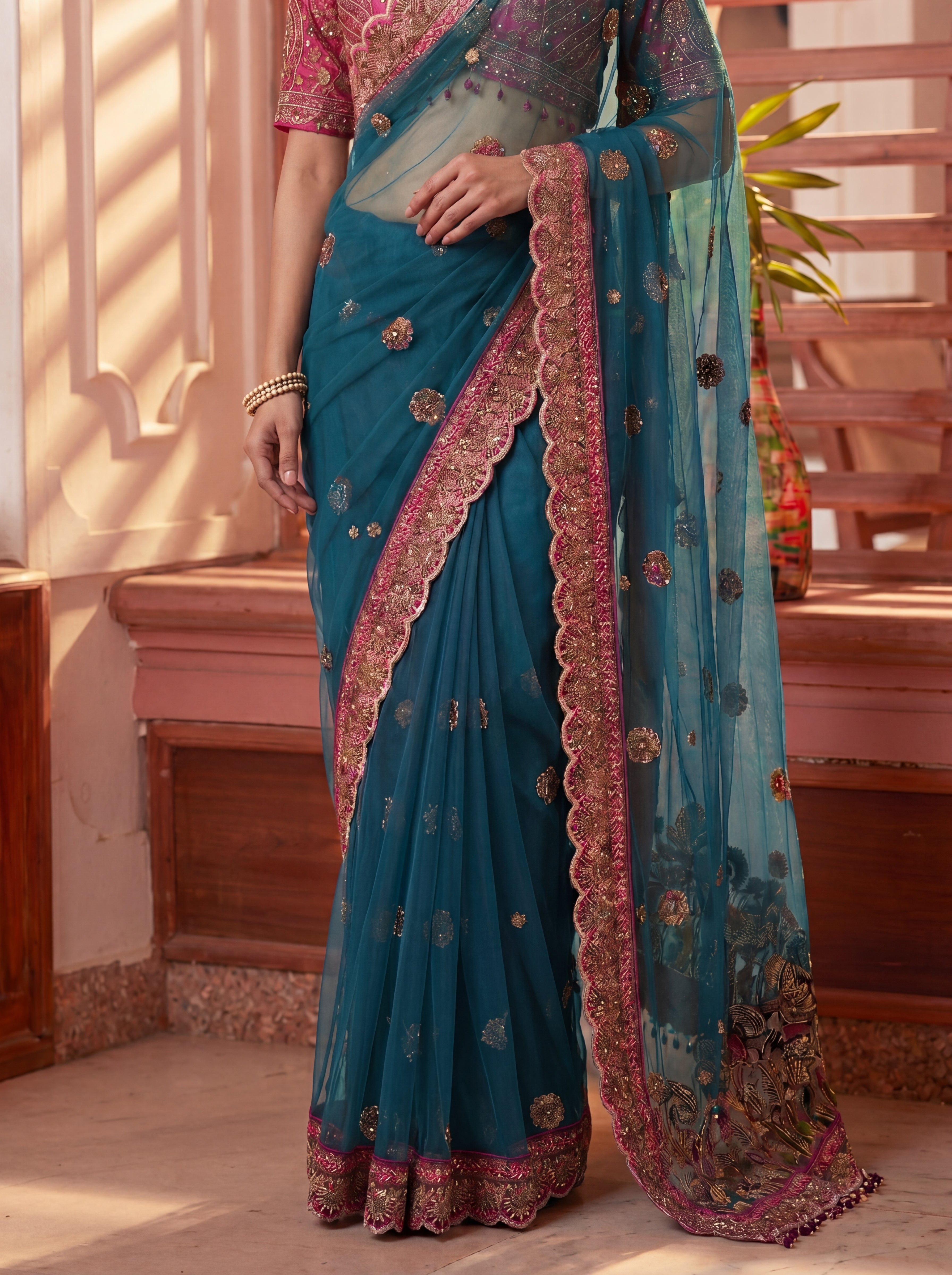 Royal Firozi Net Saree with Intricate Sequins, Mirror Work, Embroidery, Cording & Handcrafted Border Detailing