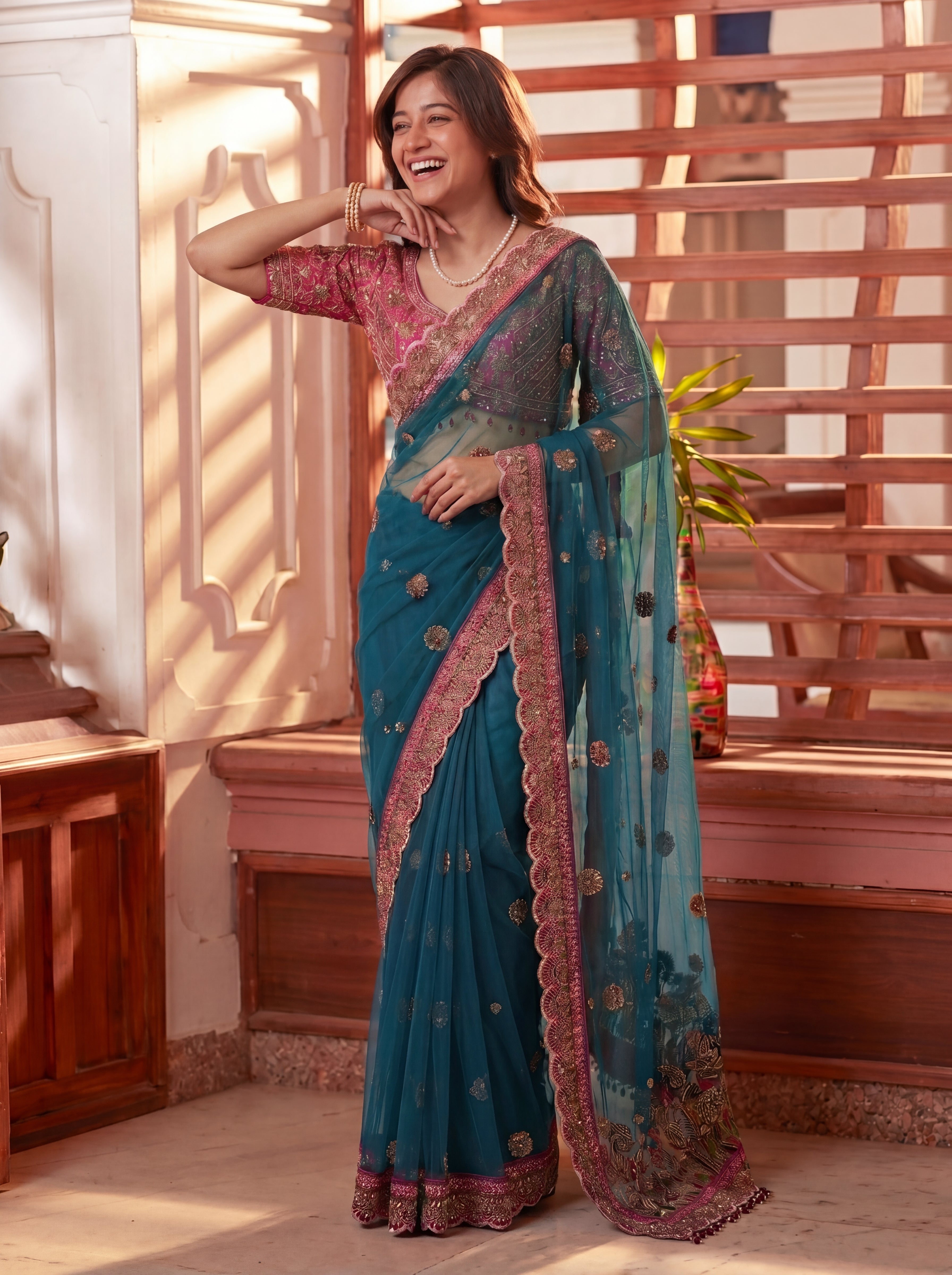 Royal Firozi Net Saree with Intricate Sequins, Mirror Work, Embroidery, Cording & Handcrafted Border Detailing