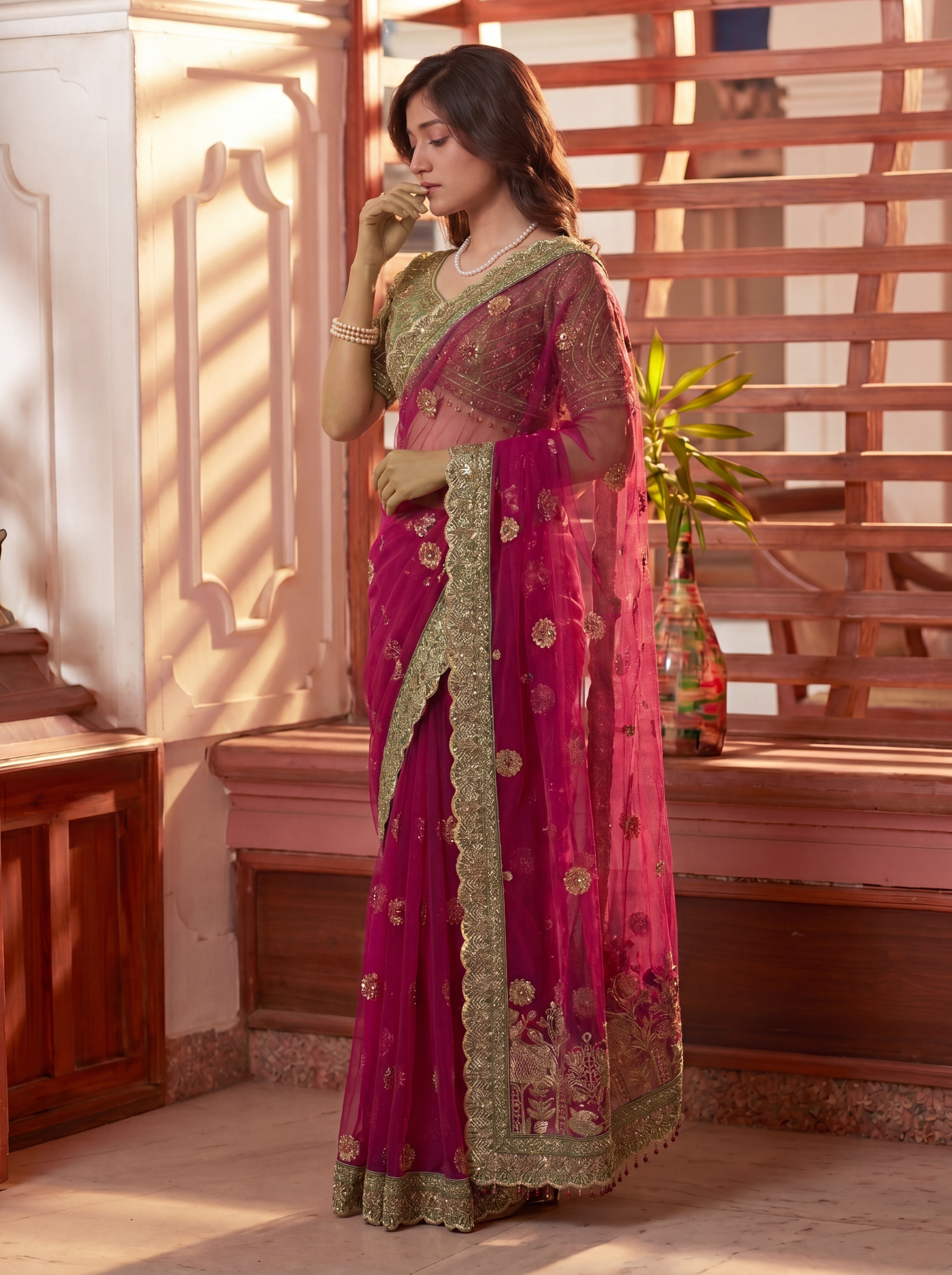 Royal Rani Net Saree with Intricate Sequins, Mirror Work, Embroidery, Cording & Handcrafted Border Detailing