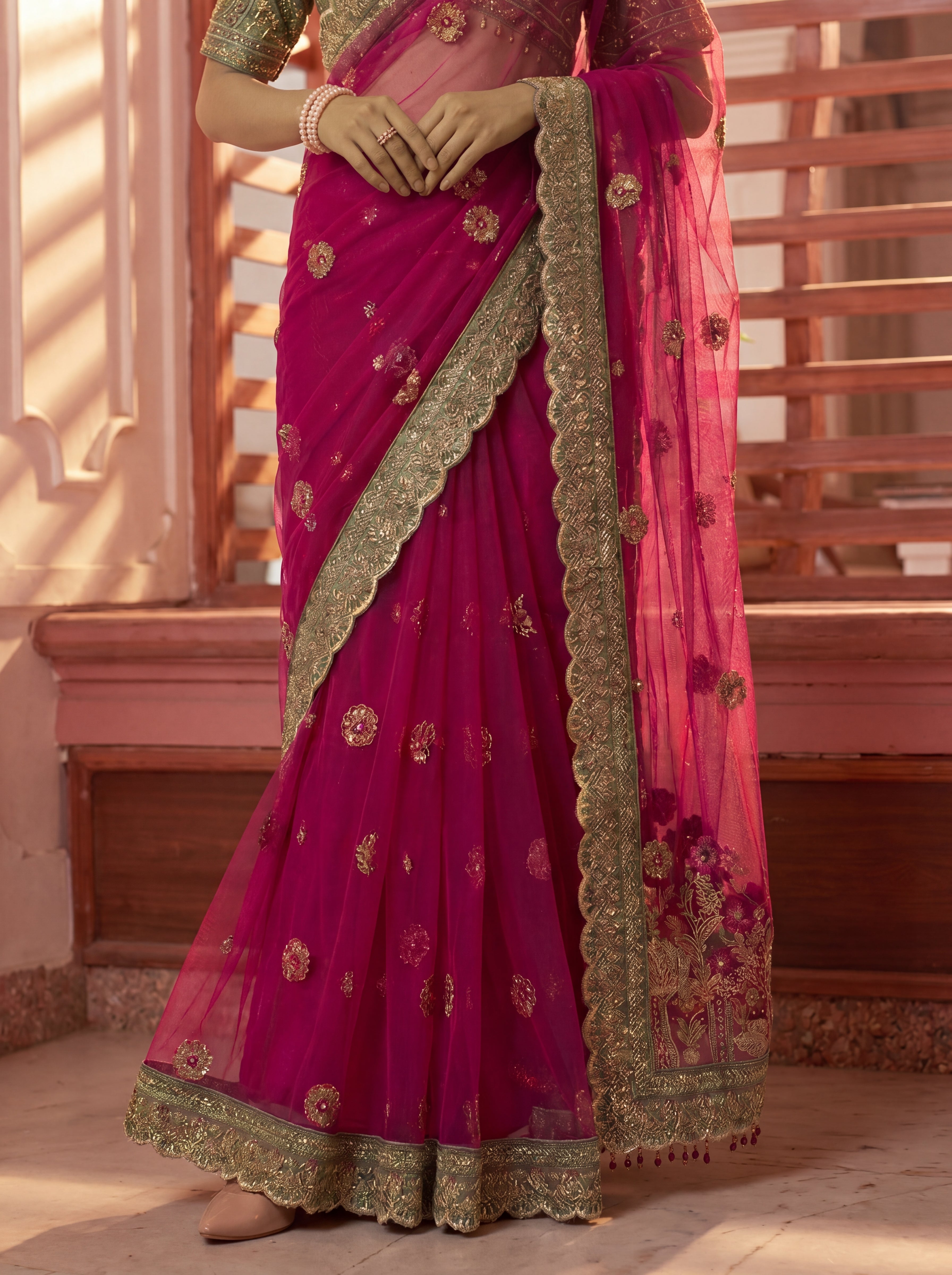 Royal Rani Net Saree with Intricate Sequins, Mirror Work, Embroidery, Cording & Handcrafted Border Detailing