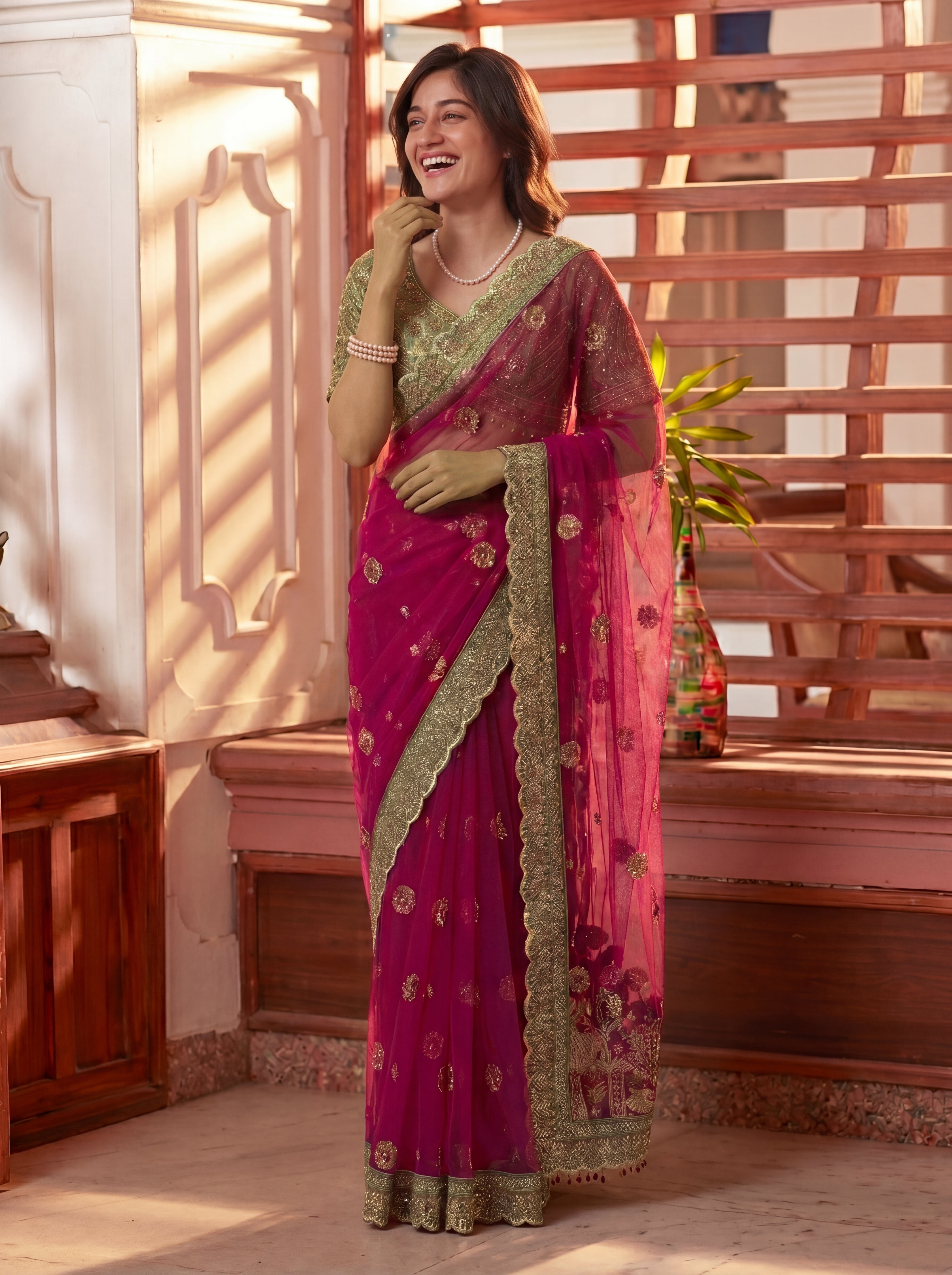 Royal Rani Net Saree with Intricate Sequins, Mirror Work, Embroidery, Cording & Handcrafted Border Detailing