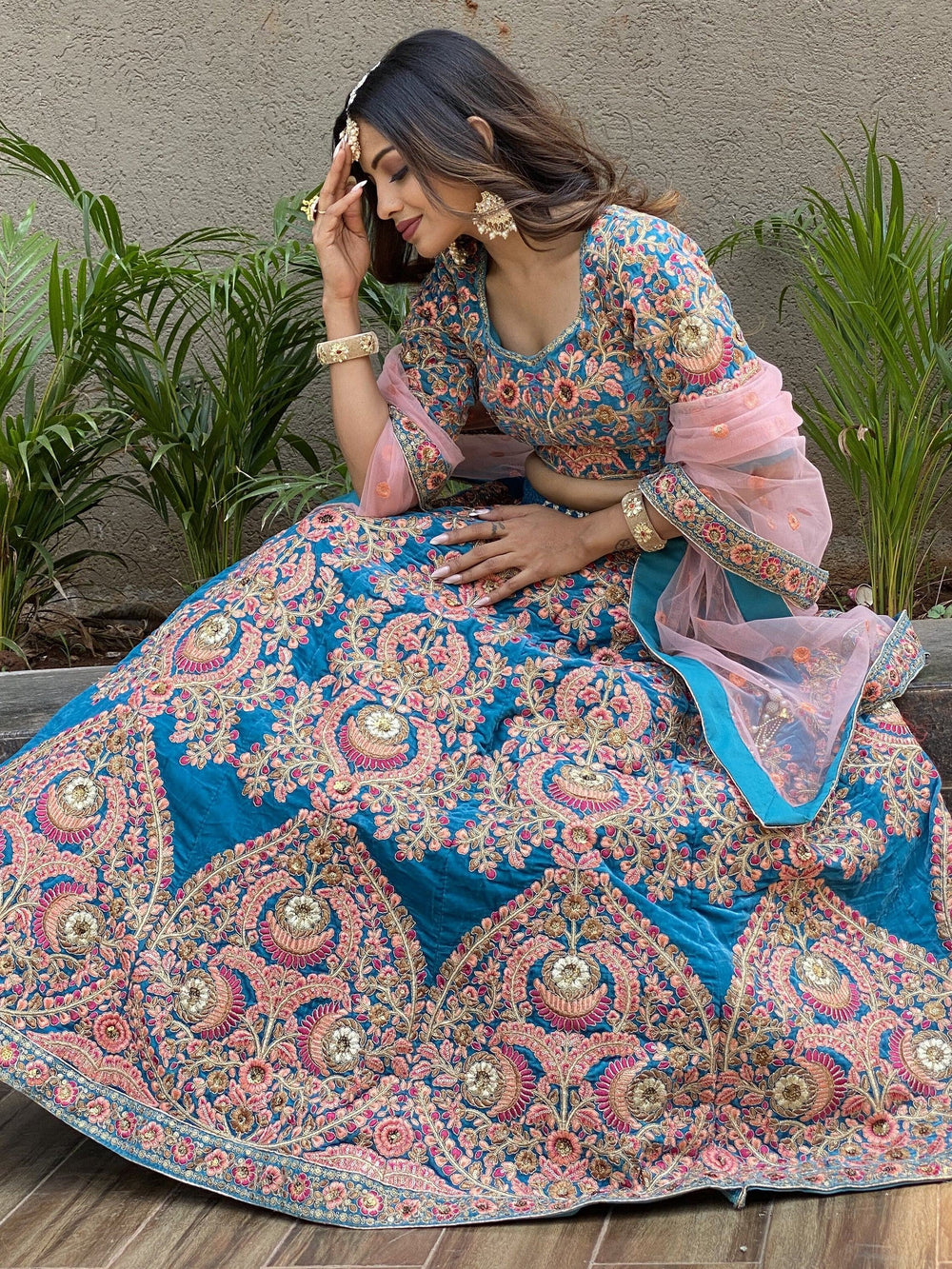 Embroidered velvet lehenga choli with zari sequins work for wedding and bridal occasions