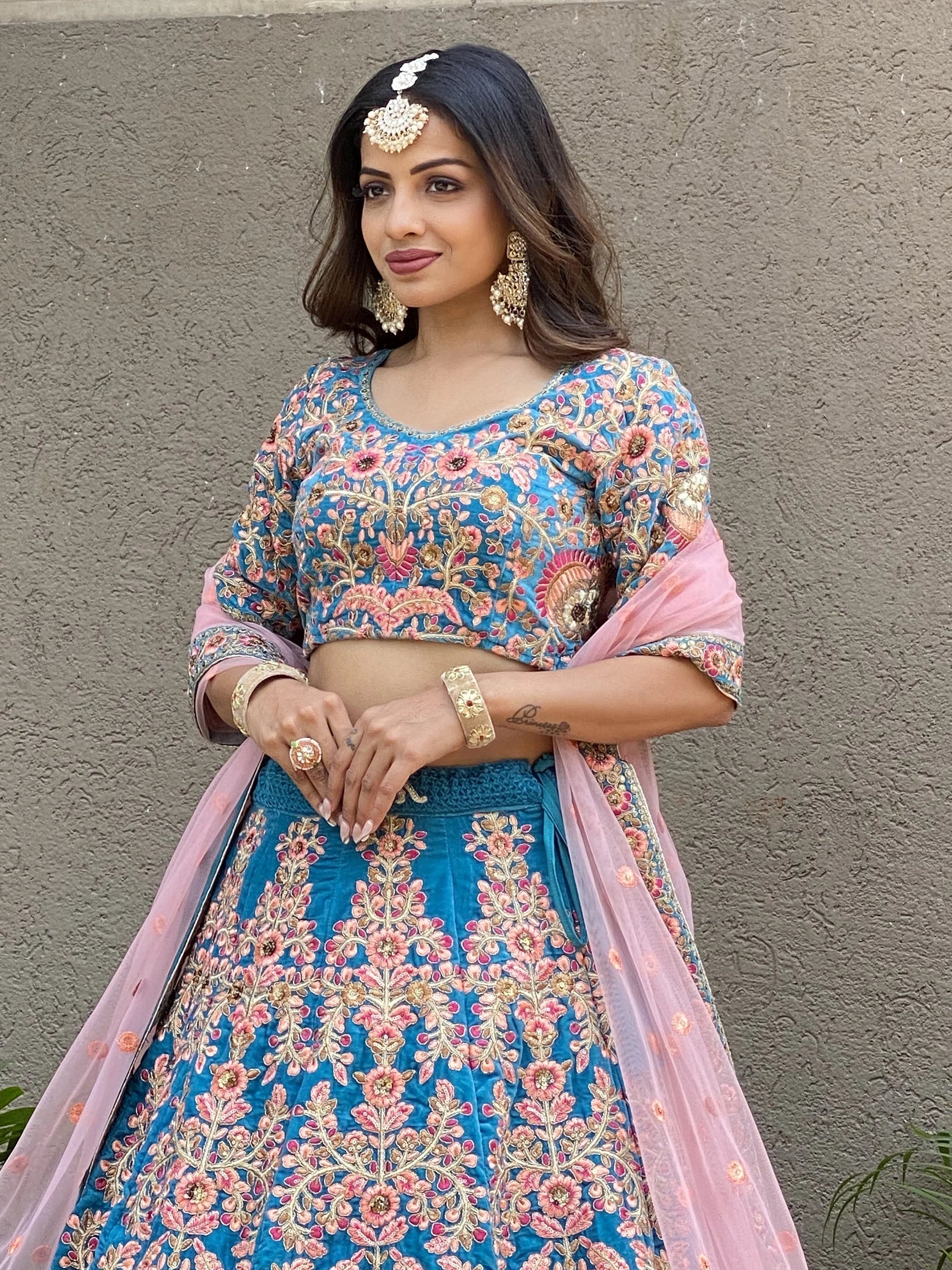 Embroidered velvet lehenga choli with zari sequins work for wedding and bridal occasions